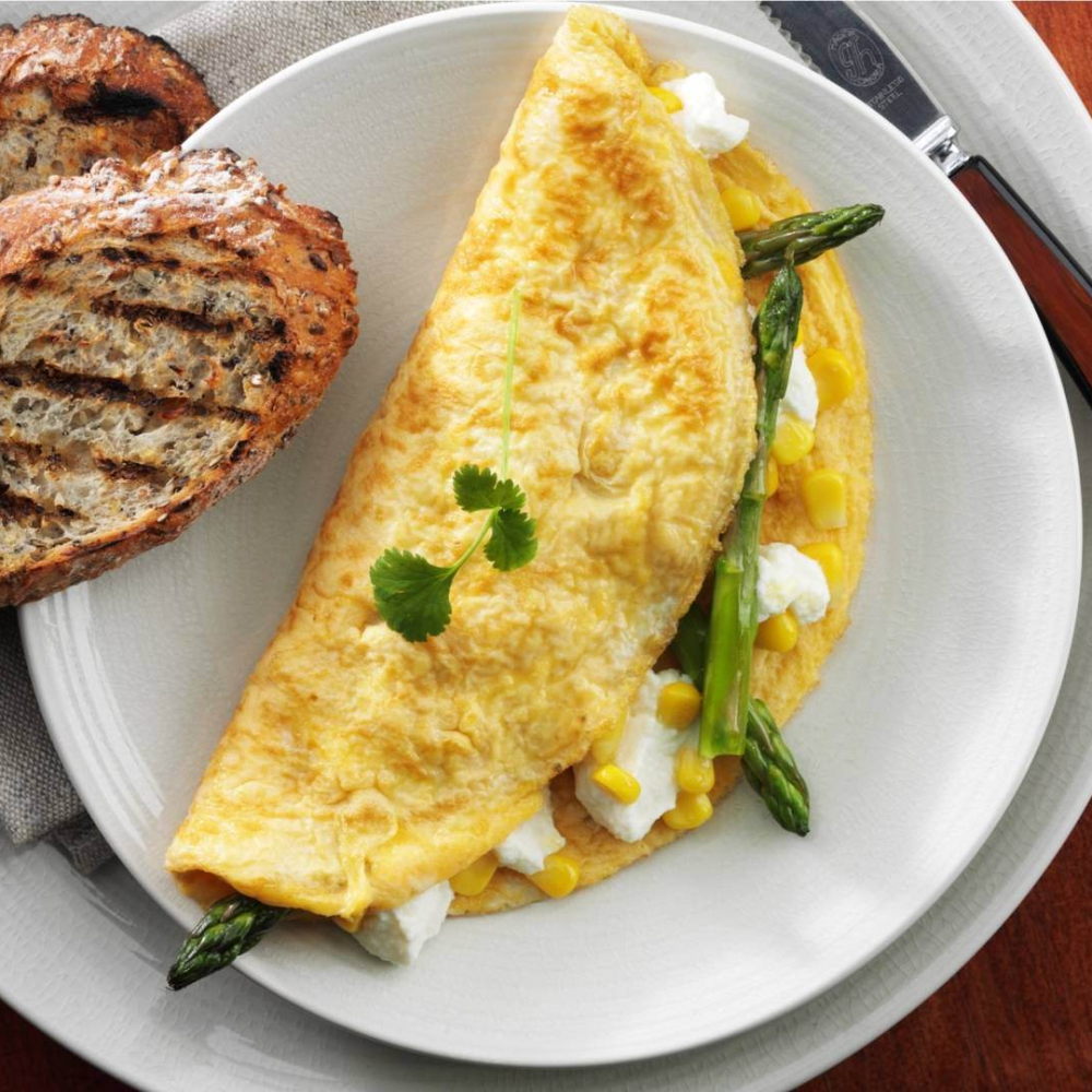 Asparagus sweet corn and cheese omelette